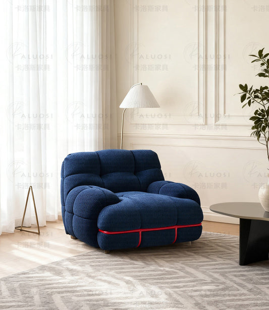 Hippopotamus sofa, ocean blue with tufted back, rounded seat and red trim piping