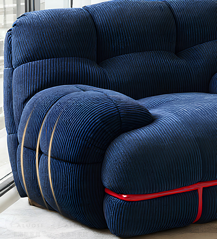 Hippopotamus sofa, ocean blue upholstered cushions with red trim piping on the base edge