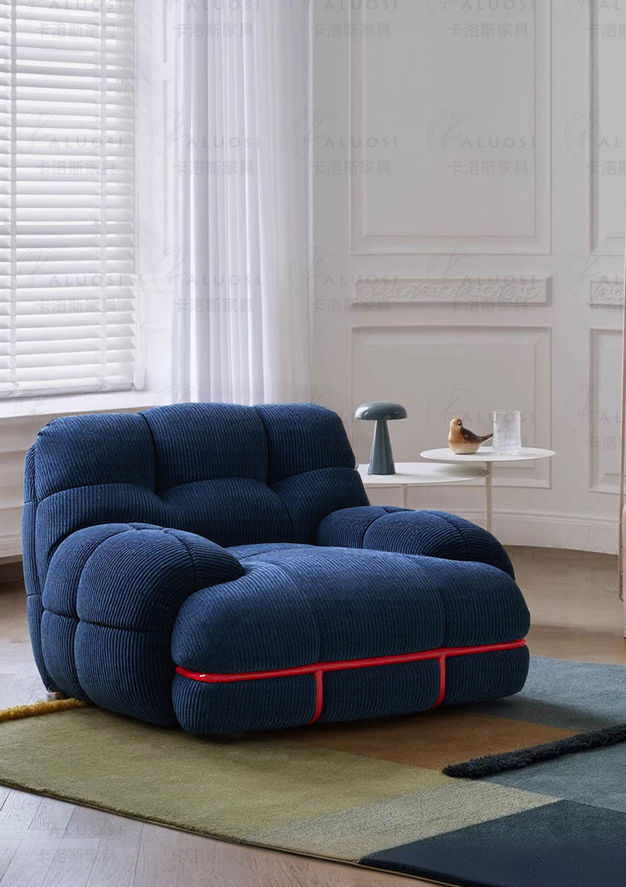 Hippopotamus sofa, ocean blue with red trim piping, wide rounded arms and chaise back