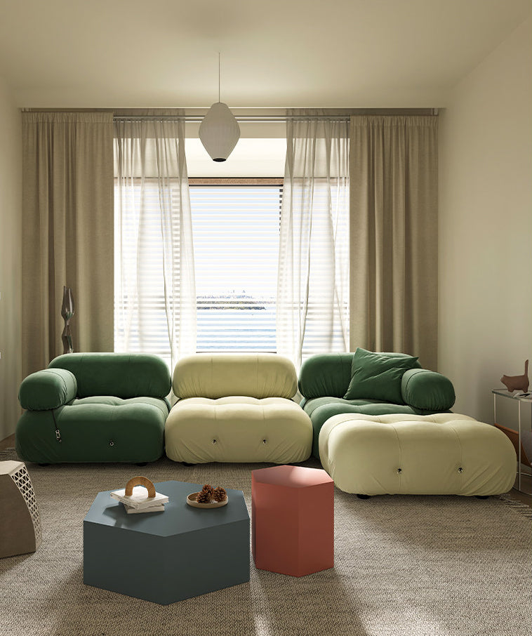 Green and yellow modular sectional sofa with rounded armrests and plush cushions