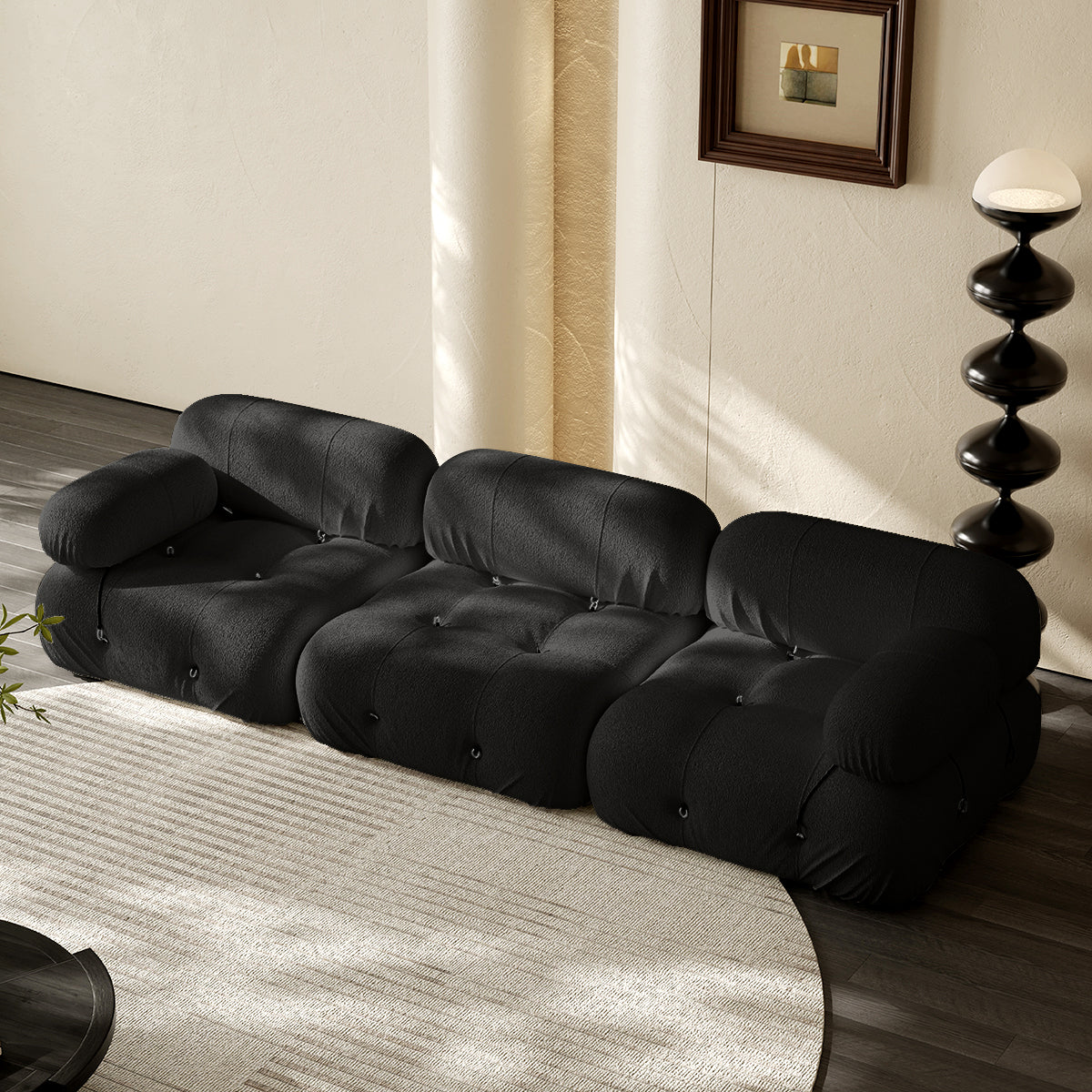 3-seater vacuum packed compression sofa in black, tufted cushions and rounded arms