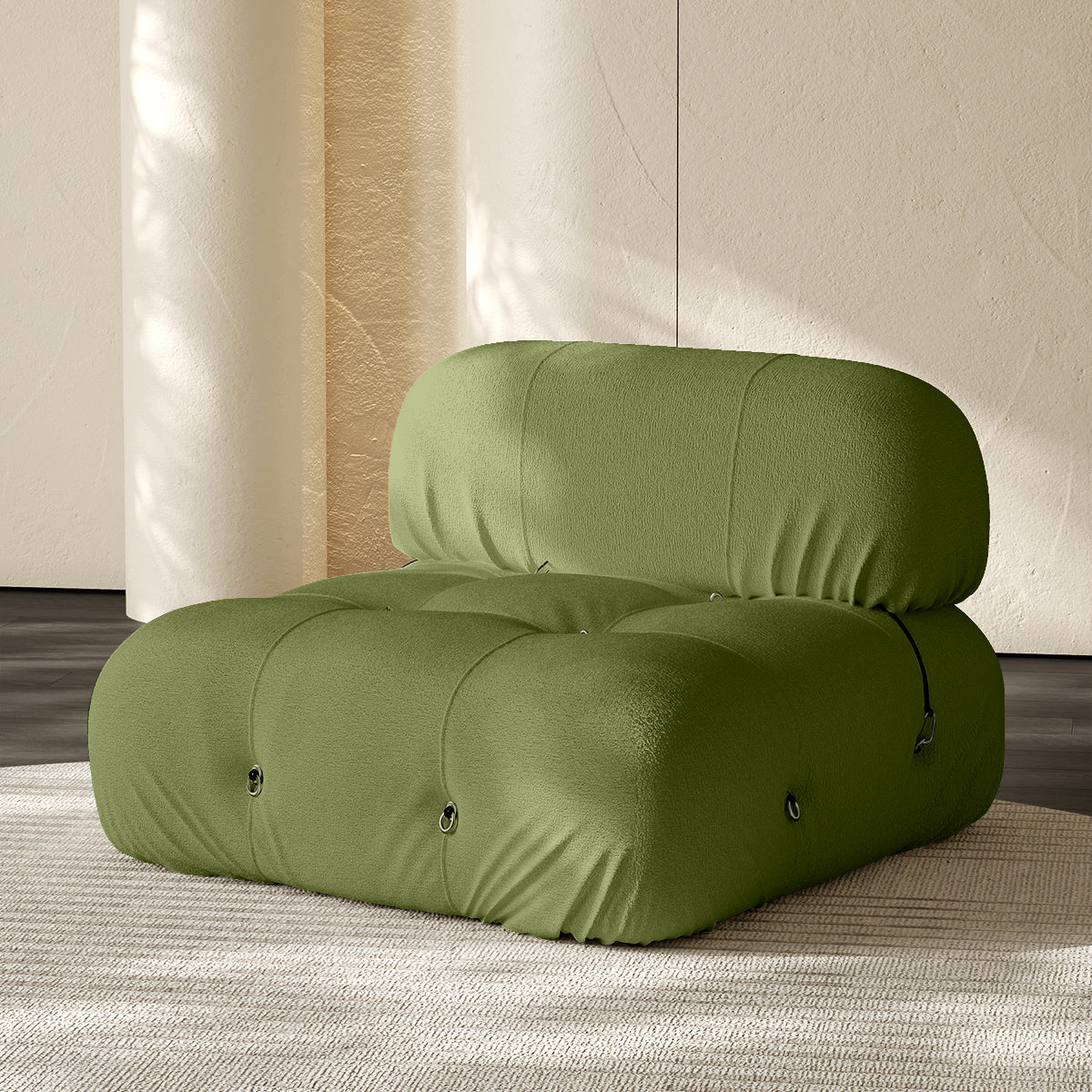 Armless single module sofa in grass green, tufted back and padded roll cushions.