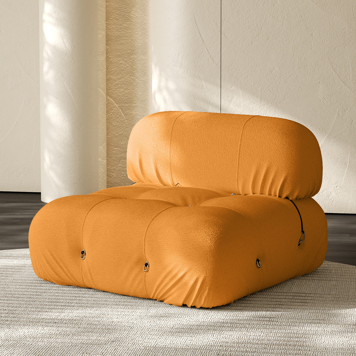 Armless single module sofa in yellow, tufted back and padded roll cushions.