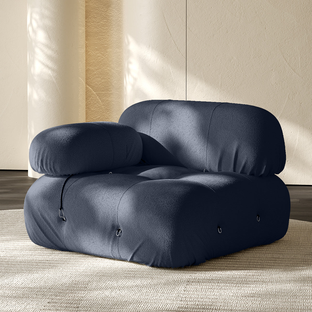 Dark blue corner sofa module with rounded arms and tufted seat back