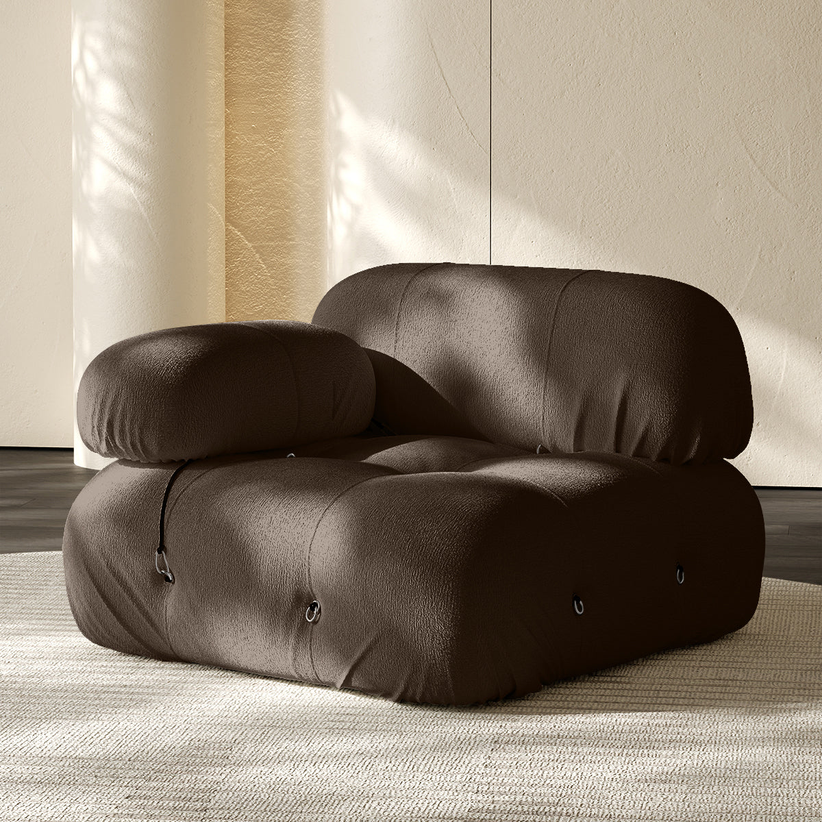 Dark gray sofa corner module with rounded backrest and seat, button-tufted details