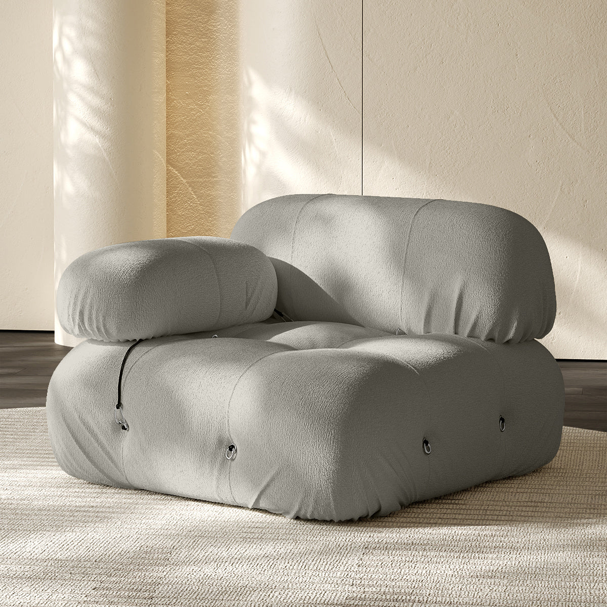Light gray sofa corner module with rounded backrest and seat, button-tufted details