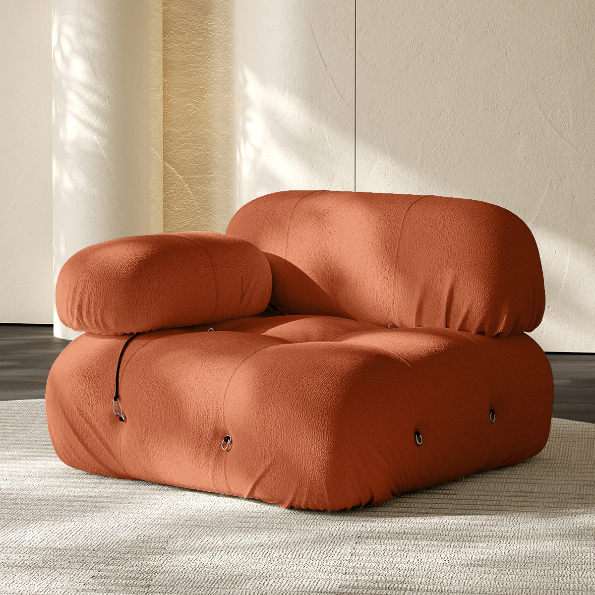 Orange sofa corner module with rounded backrest and seat, button-tufted details