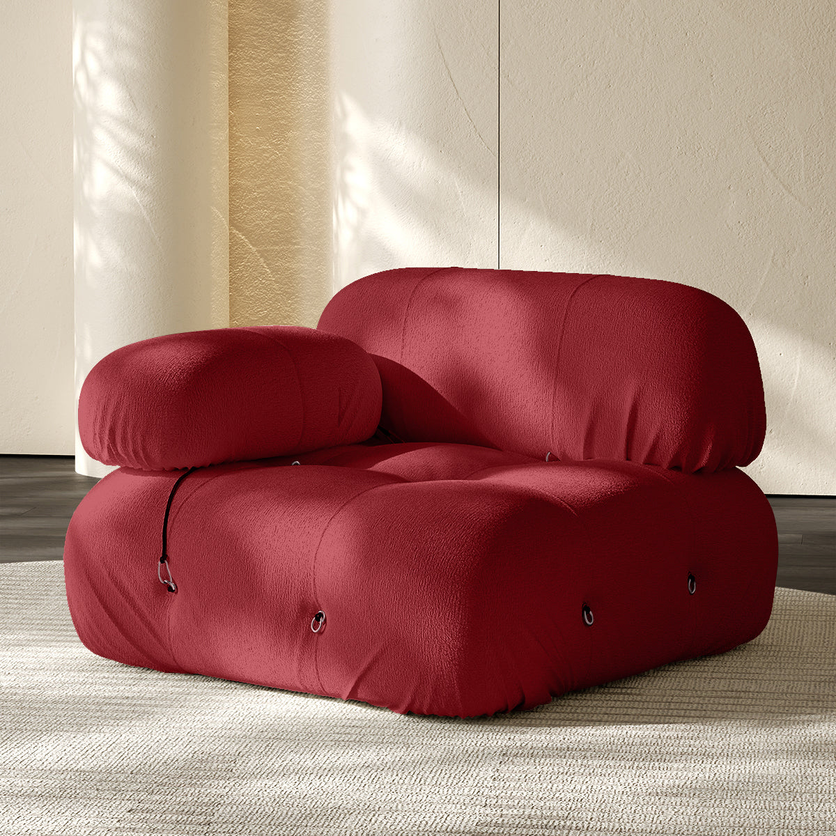 Red sofa corner module with rounded backrest and seat, button-tufted details