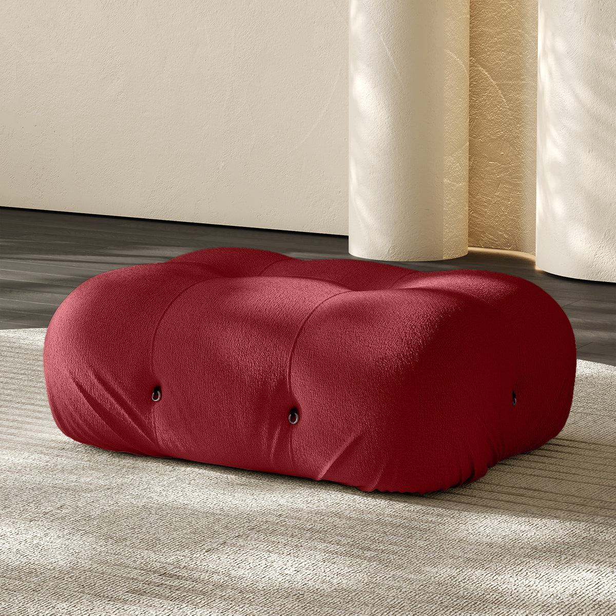 Vacuum-packed rectangular ottoman, rolled upholstered cushion in red.