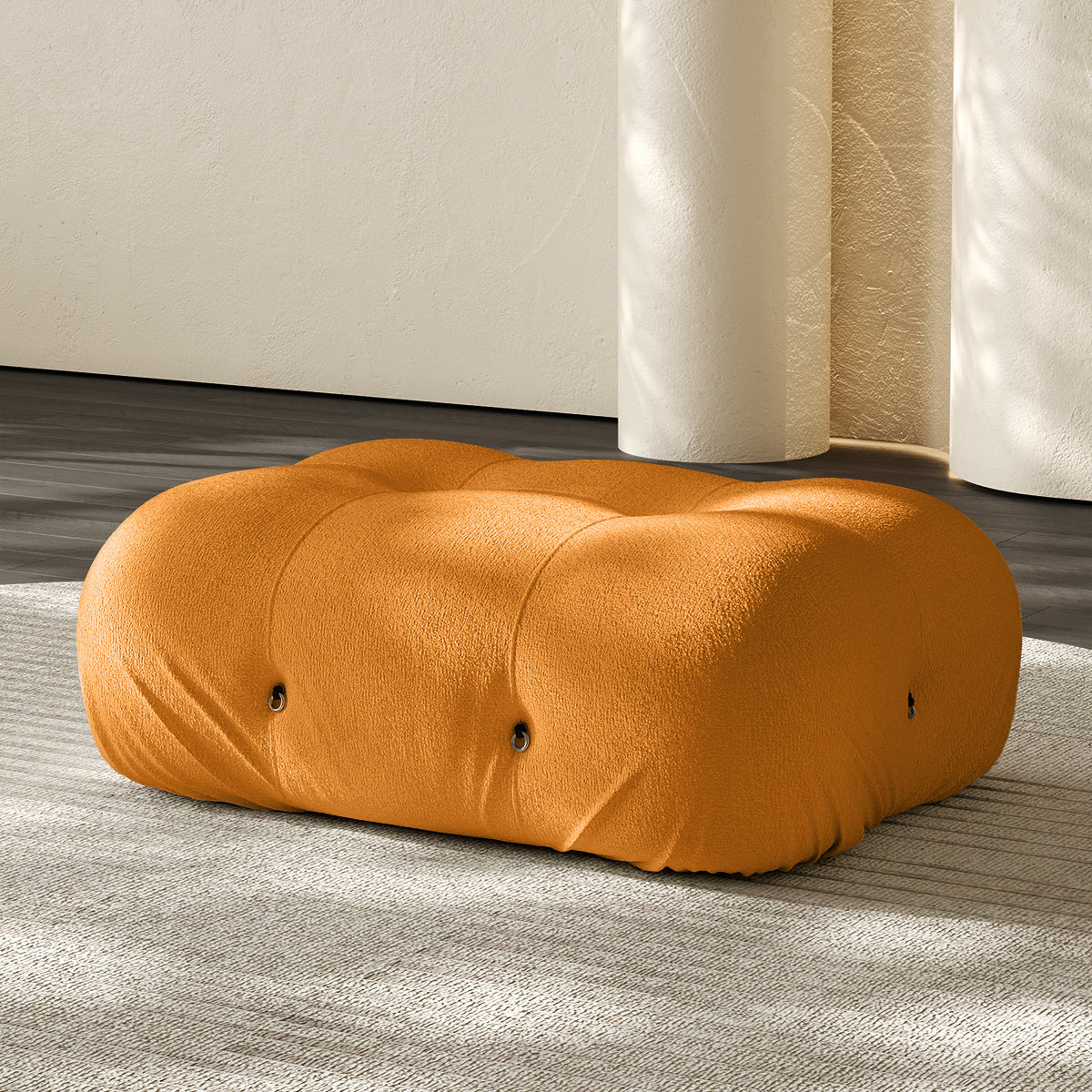 Orange rectangular ottoman with cushioned top and small button details