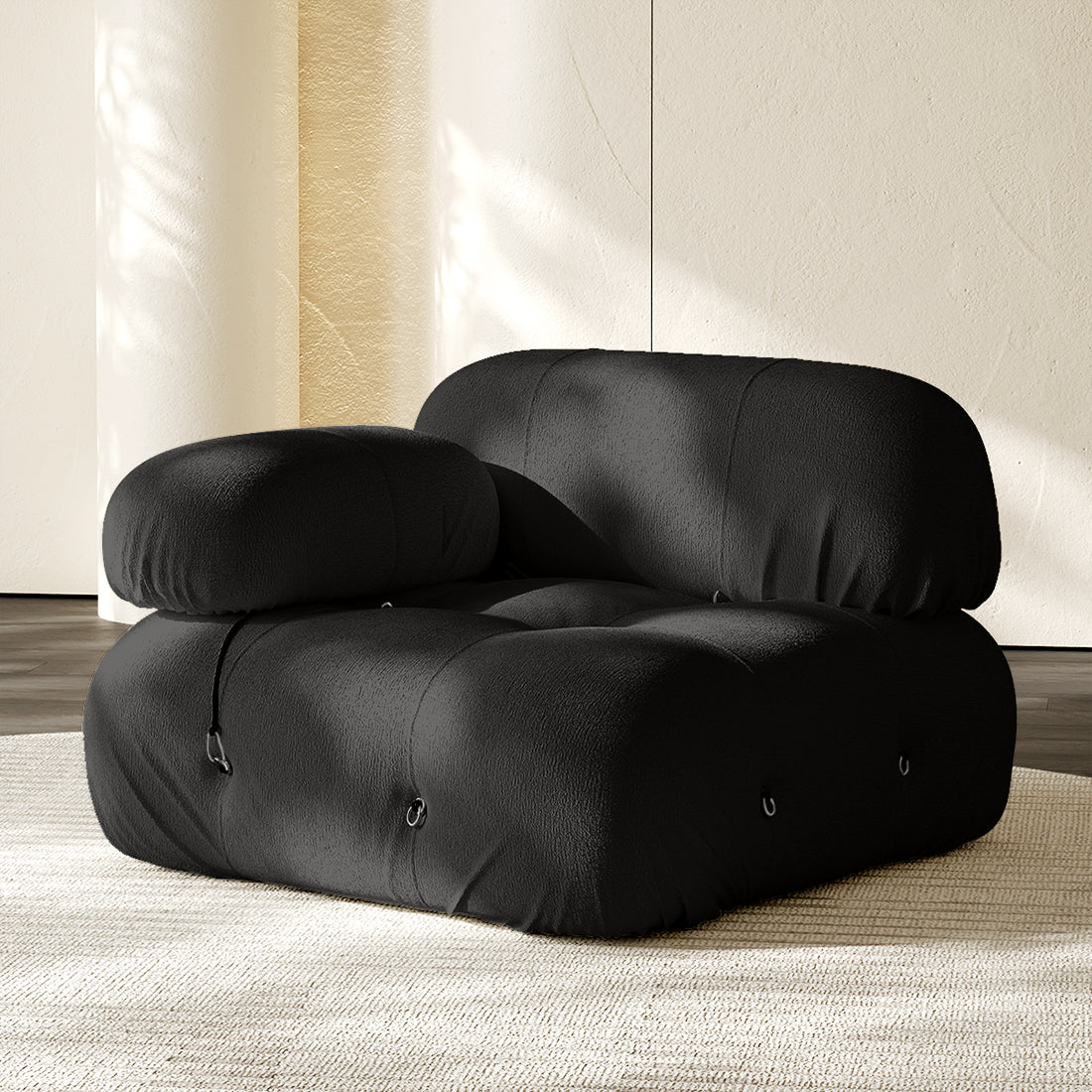 Hiksnra Camaleonda sofa.corner module in black chenille,with a rounded armrest for flexible modular layouts.
