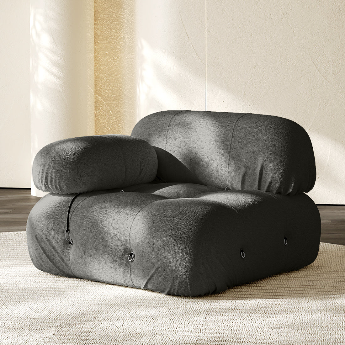 Hiksnra Camaleonda sofa.corner module in dark gray chenille,with a rounded armrest for flexible modular layouts.