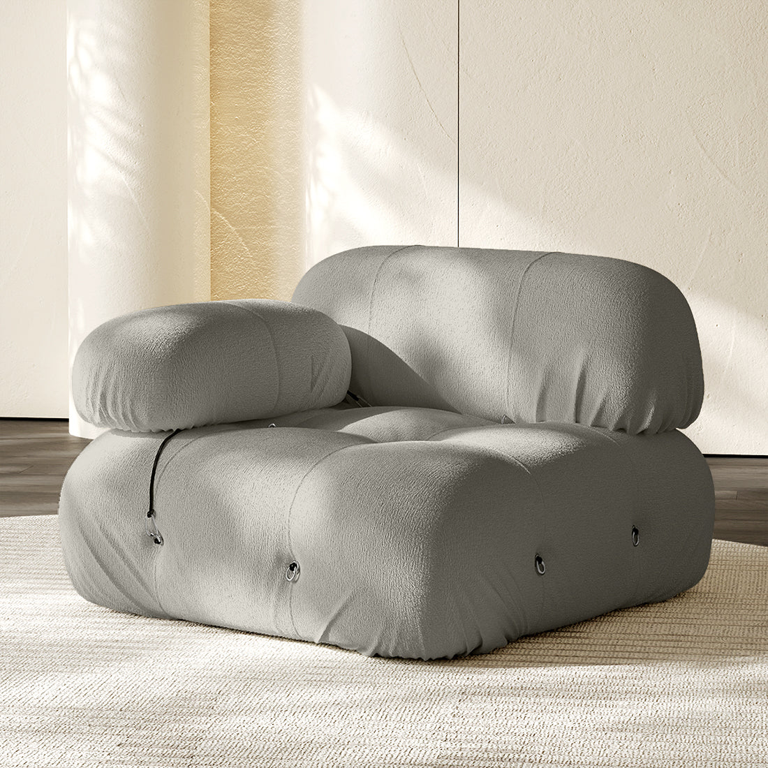 Hiksnra Camaleonda sofa.corner module in light gray chenille,with a rounded armrest for flexible modular layouts.