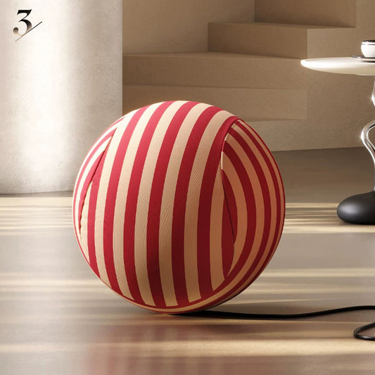 Matching round ottoman for the Hiksnra La Mamma UP5_6 lounge chair, with red and beige striped upholstery for comfortably resting your feet.