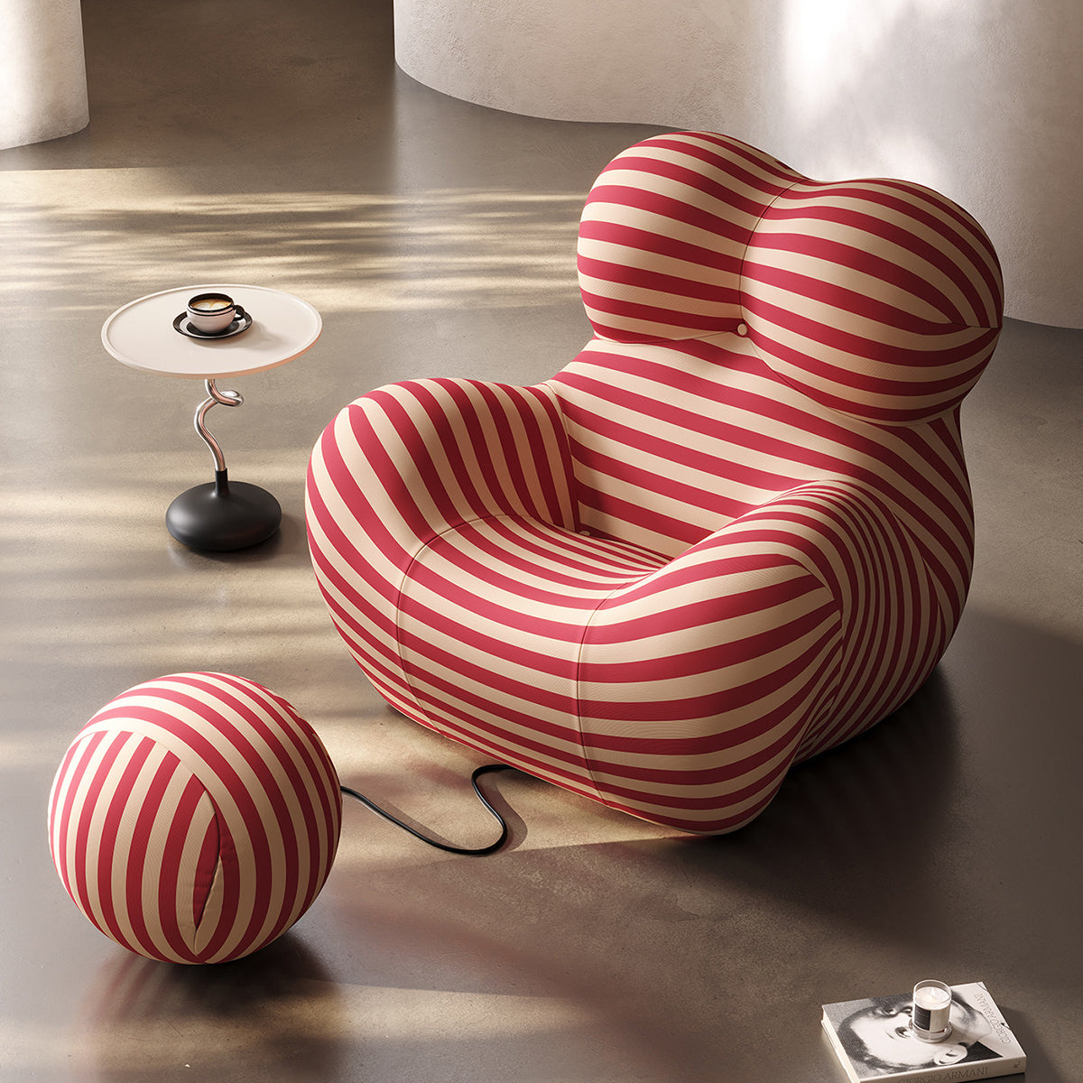 Red and beige striped soft lounge chair with tufted back and round ottoman
