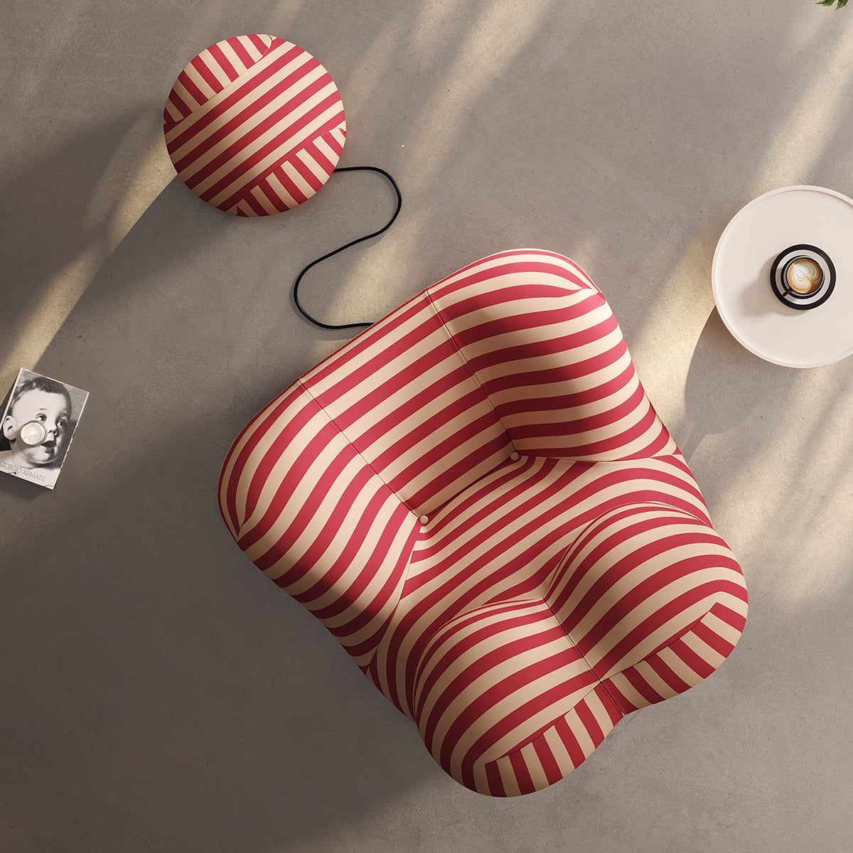 Red and beige striped lounge chair with round ottoman, viewed from above