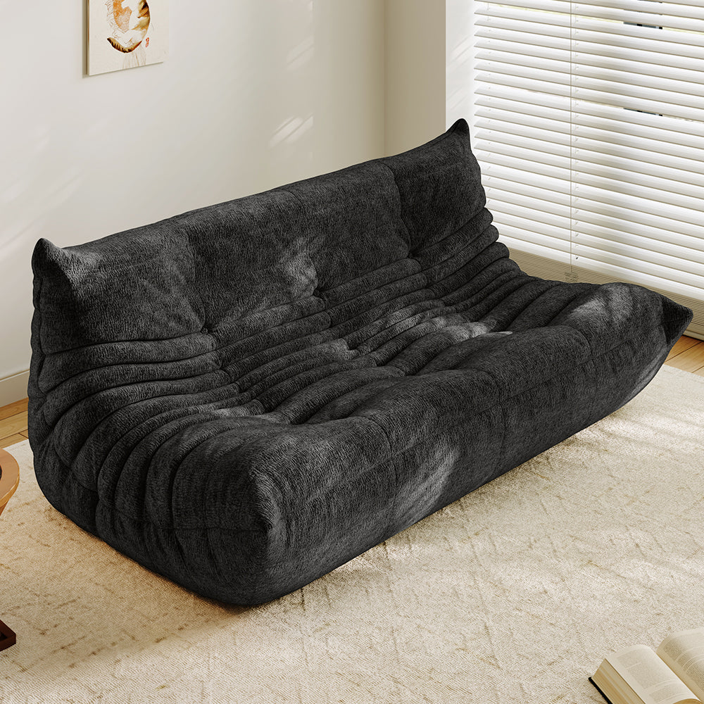 3-seater sofa bed in dark gray, tufted back and ribbed padded seat with curved arms