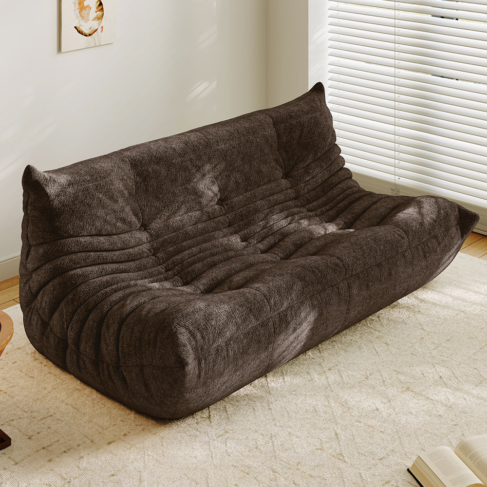3-seater sofa bed in brown, tufted back and ribbed padded seat with curved arms