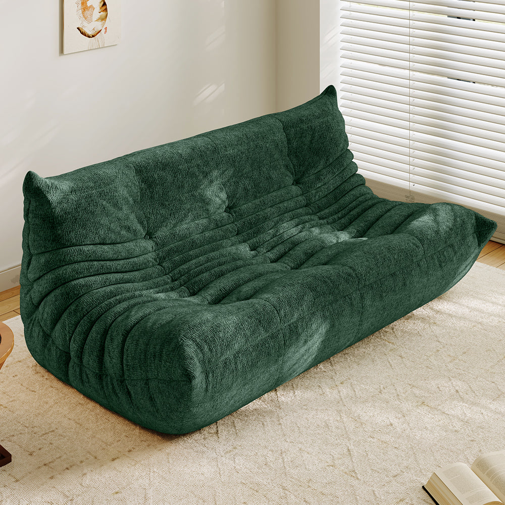 3-seater sofa bed in green, tufted back and ribbed padded seat with curved arms