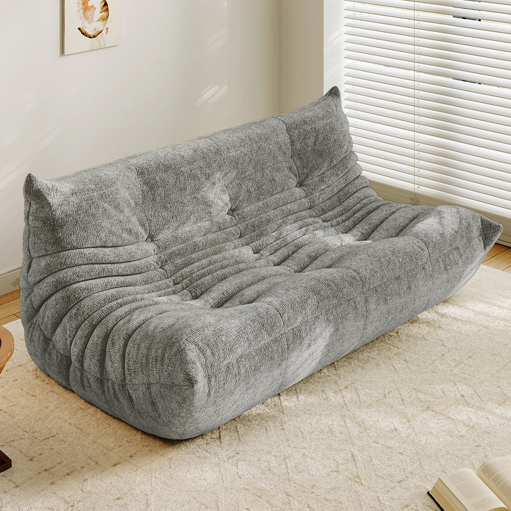 3-seater sofa bed in light gray, tufted back and ribbed padded seat with curved arms