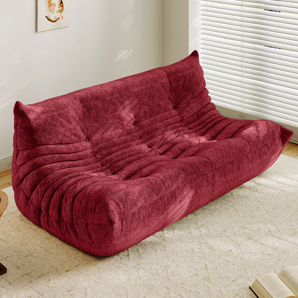 3-seater sofa bed in red, tufted back and ribbed padded seat with curved arms