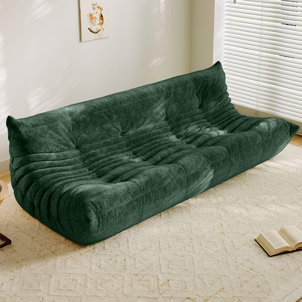 4-seater vacuum-packed sofa in dark green, tufted cushions and ribbed backrest.
