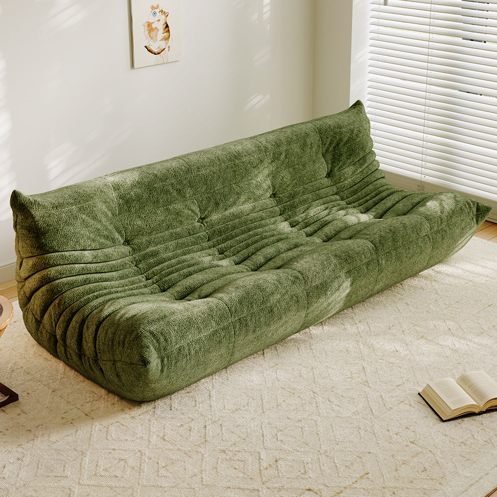 4-seater vacuum-packed sofa in green, tufted cushions and ribbed backrest.